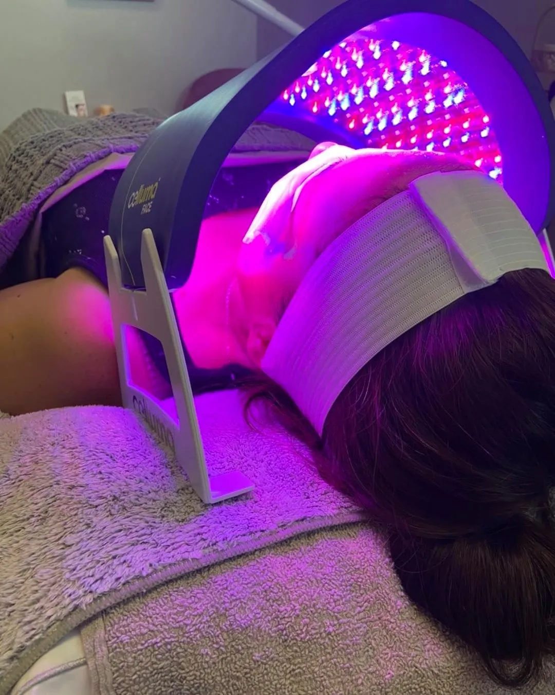A client under the Celluma LED panel