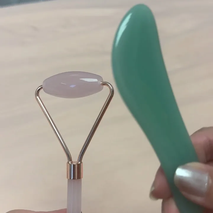 Gua sha stones and a rose quartz roller