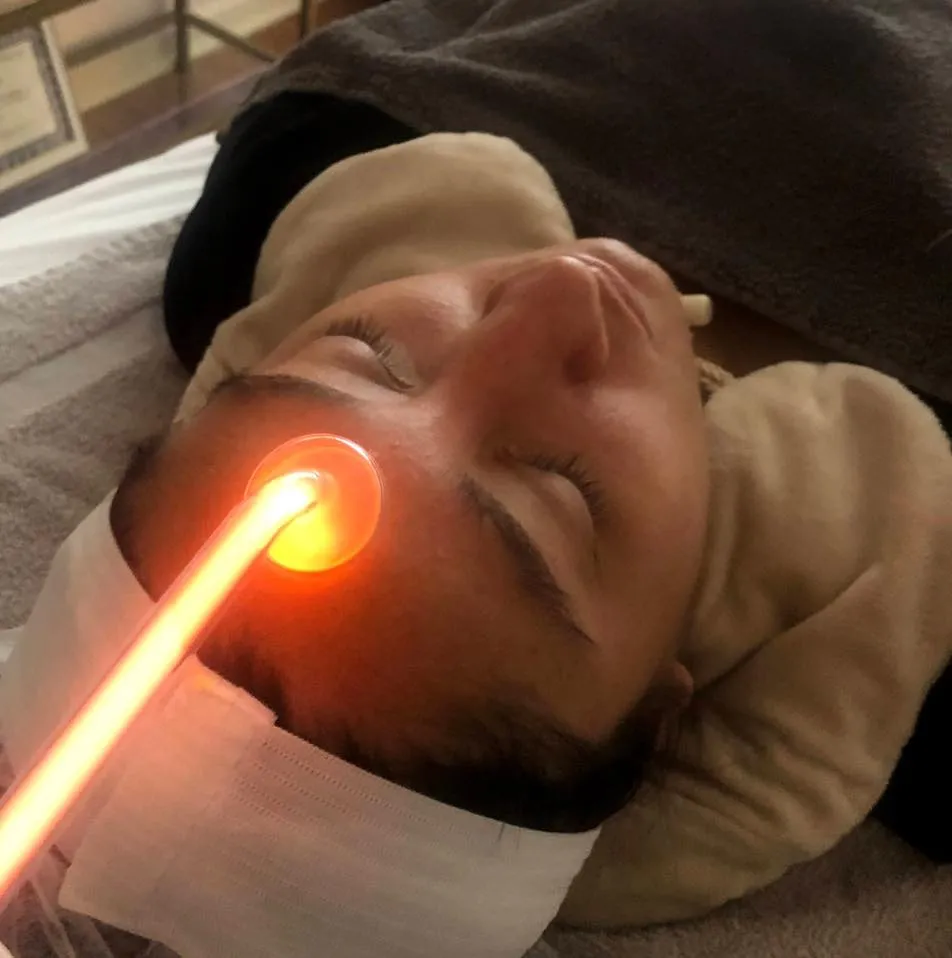 High frequency being used on a client's skin