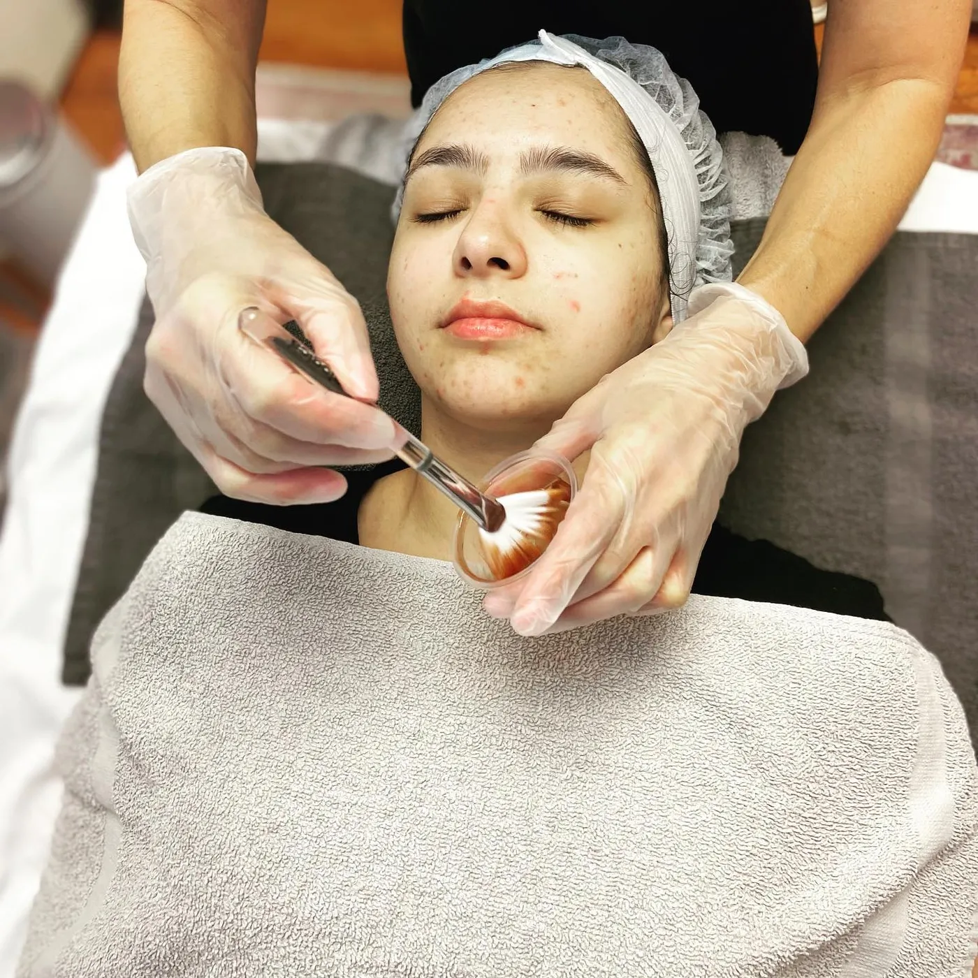 A treatment mask being brushed on
